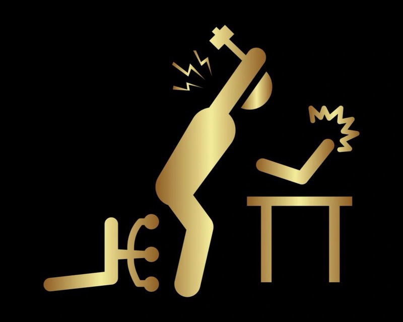 Gold stick figure smashing a desk with a hammer
